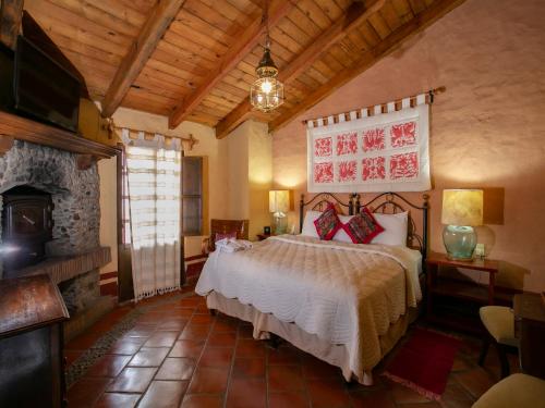 Postel nebo postele na pokoji v ubytování Hotel Casona de Manzano