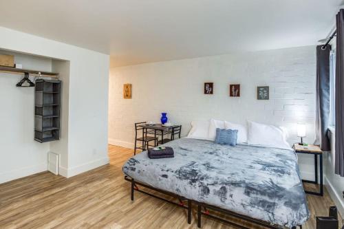 a bedroom with a large bed in a room at Studio w/ King Bed near Dwtn in Rochester