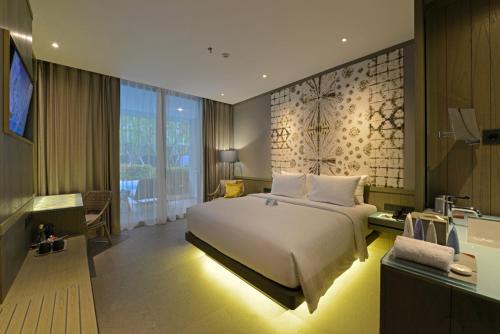 Postel nebo postele na pokoji v ubytování Kanvaz Village Resort Seminyak