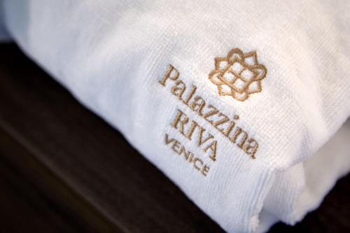 a close up of a white shirt with anaturalamineamineamineamineamineamine at Palazzina RIVA in Venice