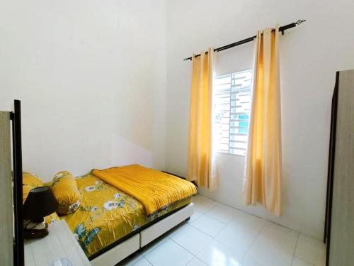 Katil atau katil-katil dalam bilik di Manjung Point Homestay