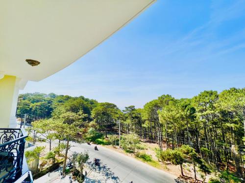 a view from the balcony of a resort with trees at CALYSSA HOTELS & VILLAGE in Khu Chi Lăng