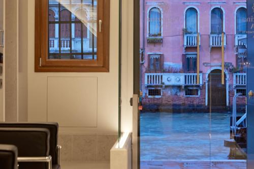 a glass door with a view of a street at Palazzina RIVA in Venice