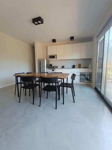 a kitchen and dining room with a table and chairs at Rincon de Lobos in La Estafeta