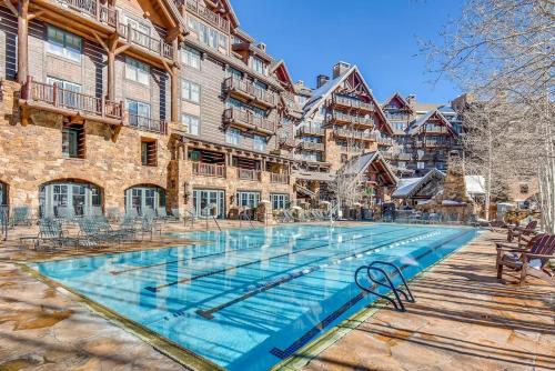 a large swimming pool in front of a building at Ritz-Carlton Bachelor Gulch in Avon