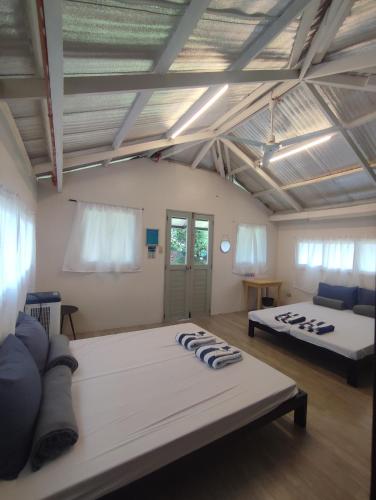 a room with two beds in a room at Caliraya Mountain Lake Resort in Cavinti