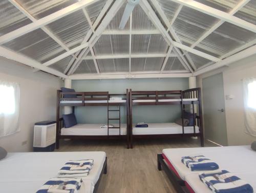 a room with two bunk beds in it at Caliraya Mountain Lake Resort in Cavinti
