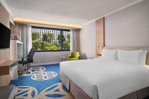 Postel nebo postele na pokoji v ubytování Concorde Hotel Singapore