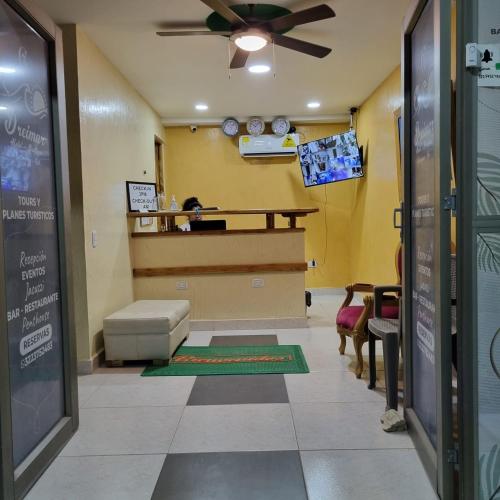 a waiting room with a counter in a restaurant at Dreimar Hotel Boutique in Cartagena de Indias