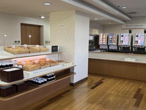 a store with a bakery with pastries on display at Hotel Alpha-One Koriyama in Koriyama