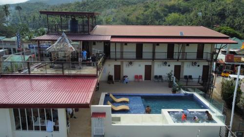 an aerial view of a building with a swimming pool at Villa Pamana Inn Puerto Galera powered by Cocotel in Puerto Galera