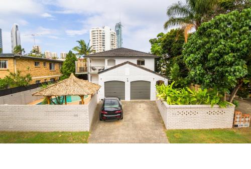 a car parked in front of a garage at Villa 1 and Villa 2 in Gold Coast