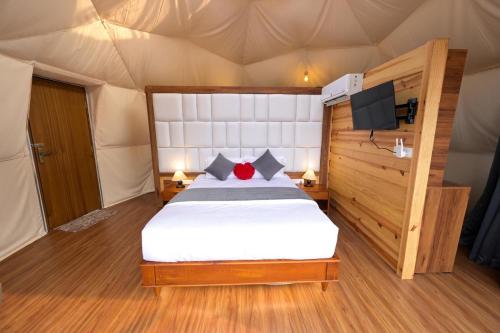 a bedroom with a bed in a tent at Vythiri Tea valley in Vythiri