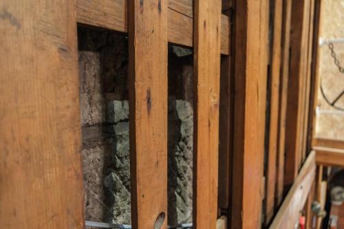 a wooden cabinet with some dirt inside of it at Stone Lodge 小樽 in Kita-hamachō