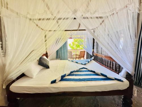 Кровать или кровати в номере Il Nido Beach Home