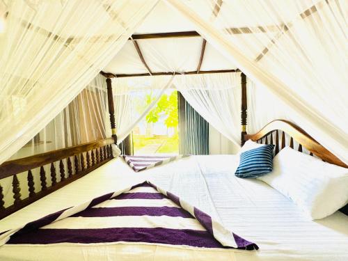 Postel nebo postele na pokoji v ubytování Il Nido Beach Home