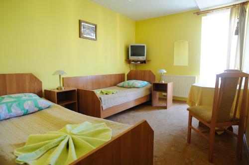 Villa Pan Tadeusz tesisinde bir odada yatak veya yataklar