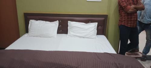 Postel nebo postele na pokoji v ubytování Shree raj palace