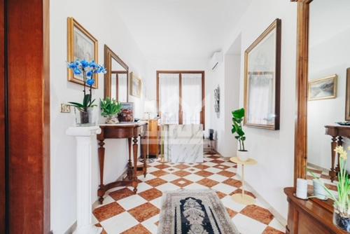a living room with a checkered floor at Gold Palace ***** in Ferrara