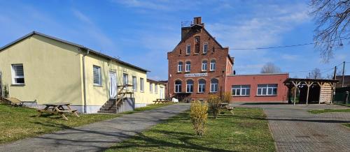 a group of buildings on a street next to a building at Gästewohnung Heinrich Heine Schule in Bad Dürrenberg