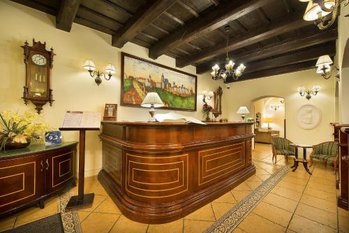 a court room with a wooden bench and a court sidx sidx sidx at Boutique Hotel Constans in Prague
