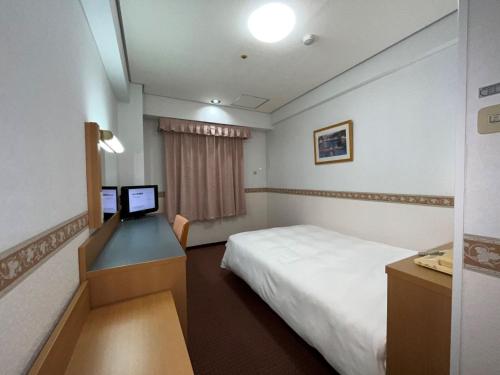 Krevet ili kreveti u jedinici u okviru objekta Hotel Alpha-One Niihama