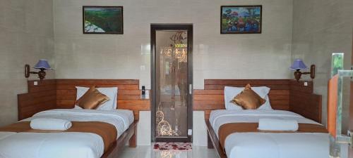 Voodi või voodid majutusasutuse 3 Bedroom Cheap In Lembongan For Backapcker toas