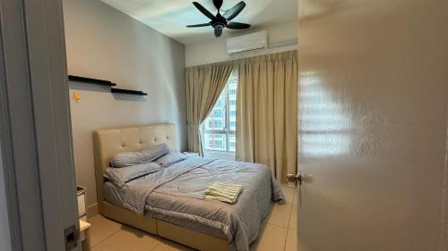 a bedroom with a bed and a ceiling fan at HH KL Prime location Residence near TRX in Kuala Lumpur