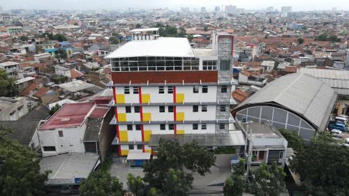 a building with colorful squares on the side of it at Front One Hotel Pasir Koja Bandung in Bandung