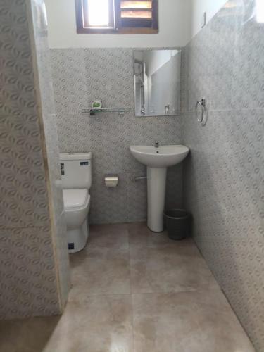a bathroom with a sink and a toilet at Kai Kazee Ella in Ella