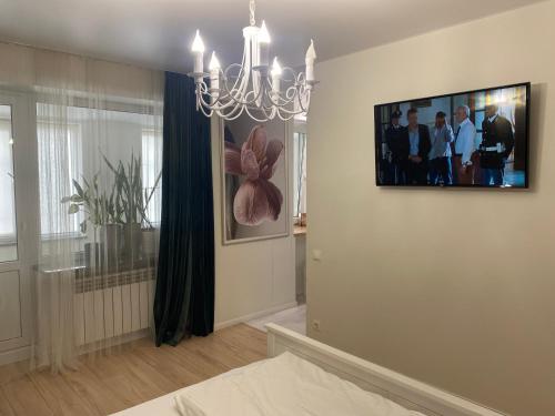 a living room with a television on a wall at Best apartments on Lyatoshinsky street in Zhytomyr