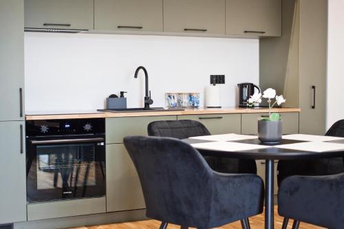 Η κουζίνα ή μικρή κουζίνα στο Apartamenty LAGOM