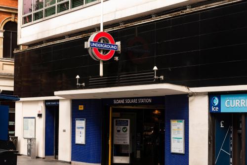 a sign on the front of a sushi service station at 3 Sloane Gardens in London