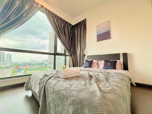 a bedroom with a bed with a large window at SKS Pavillion Residence by Luxecocoo CK Johor Bahru City Centre in Johor Bahru