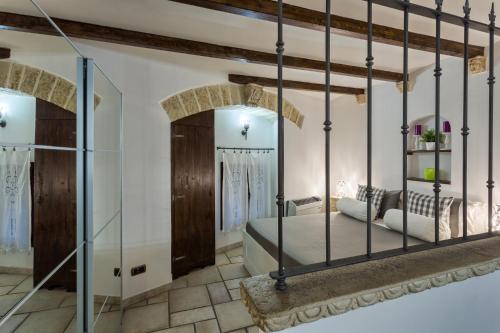 a bedroom with a bed and a mirror at Due Passi Dal Borgo Antico in Bari