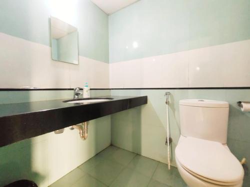 a bathroom with a toilet and a sink at Private room in Blueridge in Hinjewadi