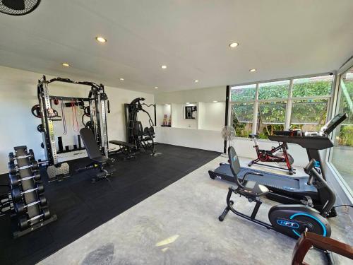 a gym with several treadmills and machines in it at Lamai Buri Resort in Lamai