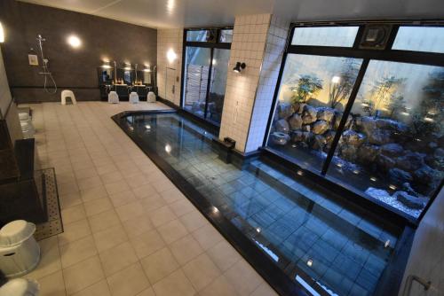 an overhead view of a swimming pool in a building at Saga Grace Hotel in Kyoto