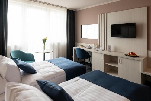 Posteľ alebo postele v izbe v ubytovaní Airport Hotel Budapest