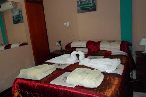 Ένα ή περισσότερα κρεβάτια σε δωμάτιο στο Hotel Antonia