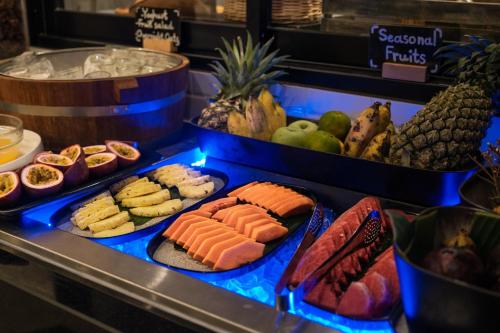 a buffet with different types of food on display at PARKROYAL Suites Bangkok in Bangkok