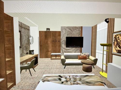 Hotel Serenity في تيميشوارا: غرفة معيشة مع أريكة وتلفزيون