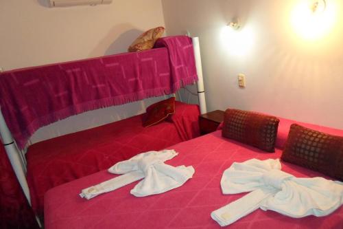 Ένα ή περισσότερα κρεβάτια σε δωμάτιο στο Hotel Antonia