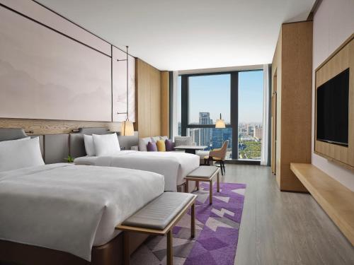 Ein Bett oder Betten in einem Zimmer der Unterkunft JW Marriott Hotel Xi'an Southwest