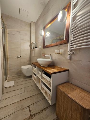 Koupelna v ubytování Apartament Powstańców A23 z dostępem do basenu BALTIC APARTAMENT