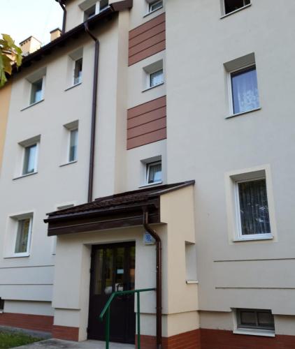 a building with a door in front of it at Apartament Natura in Lidzbark Warmiński