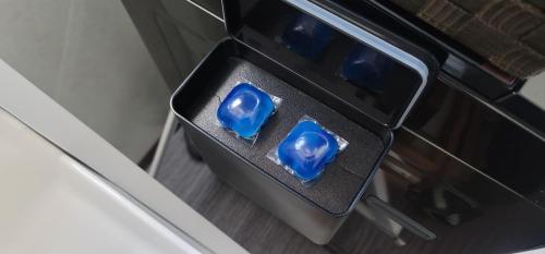 two blue glass votives sitting inside of an oven at ROMANSTAY in Takayama
