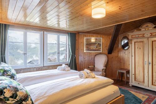 Postel nebo postele na pokoji v ubytování Chalet Schweizerhof Attic