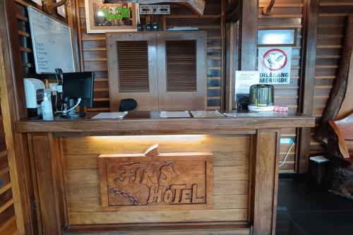 a bar in a cabin with a hotel sign on it at Fins Hotel, Alor Setar in Alor Setar