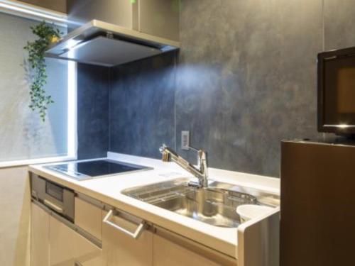 a kitchen with a sink and a counter top at Many Thanks Resort Onomichi - Vacation STAY 15792 in Onomichi